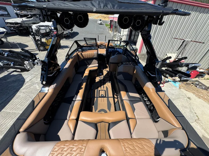 Slide: The Image of 2025 Centurion RI 245 boat interior with luxurious seating and advanced audio system. - 5