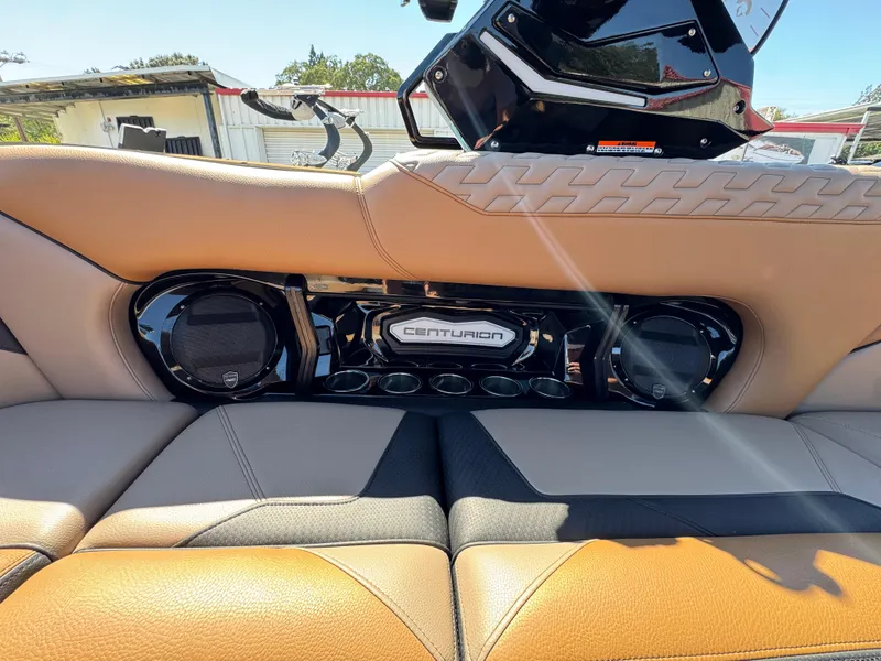 Slide: The Image of Interior of 2025 Centurion RI 245 boat with premium audio system and stylish seating. - 6