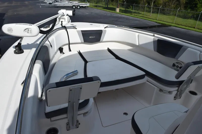Slide: The Image of 2019 Robalo R272 Center Console boat interior with cushioned seating and modern design. - 13
