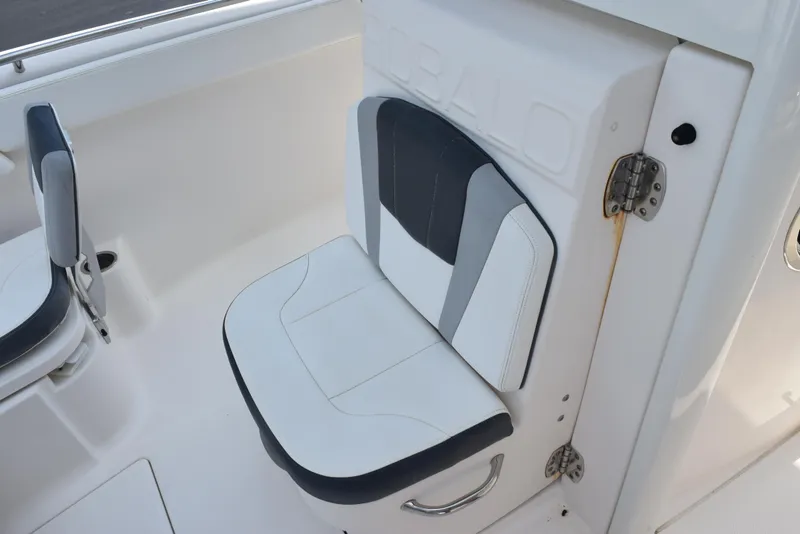 Slide: The Image of 2019 Robalo R272 Center Console boat seat with white and gray upholstery. - 14