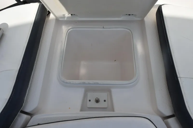 Slide: The Image of 2019 Robalo R272 Center Console storage compartment, open and empty. - 19