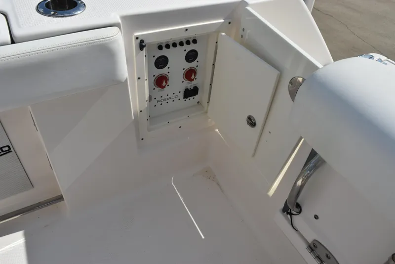 Slide: The Image of 2019 Robalo R272 Center Console boat electrical panel with open access door. - 24