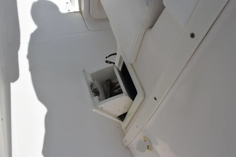 Slide: The Image of 2019 Robalo R272 Center Console storage compartment detail. - 25