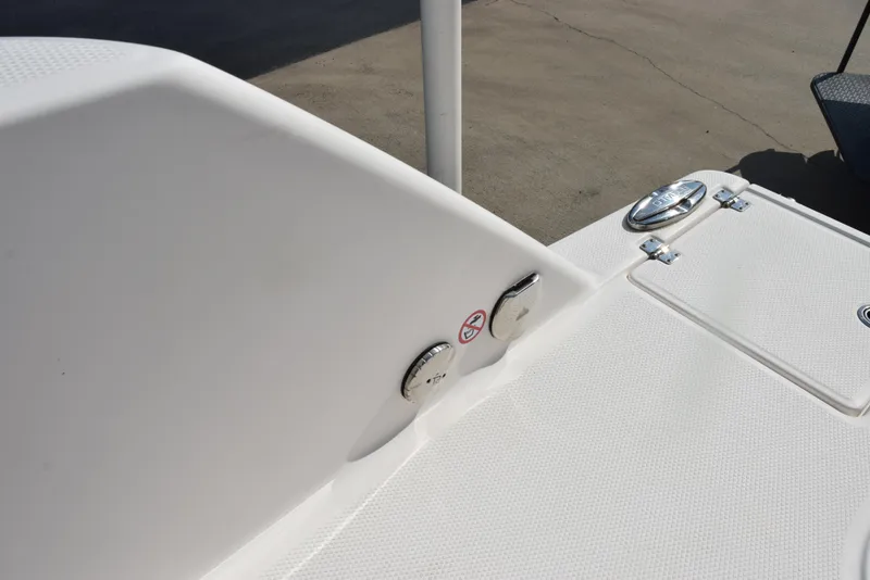 Slide: The Image of 2019 Robalo R272 Center Console boat deck with chrome fittings and textured surface. - 27