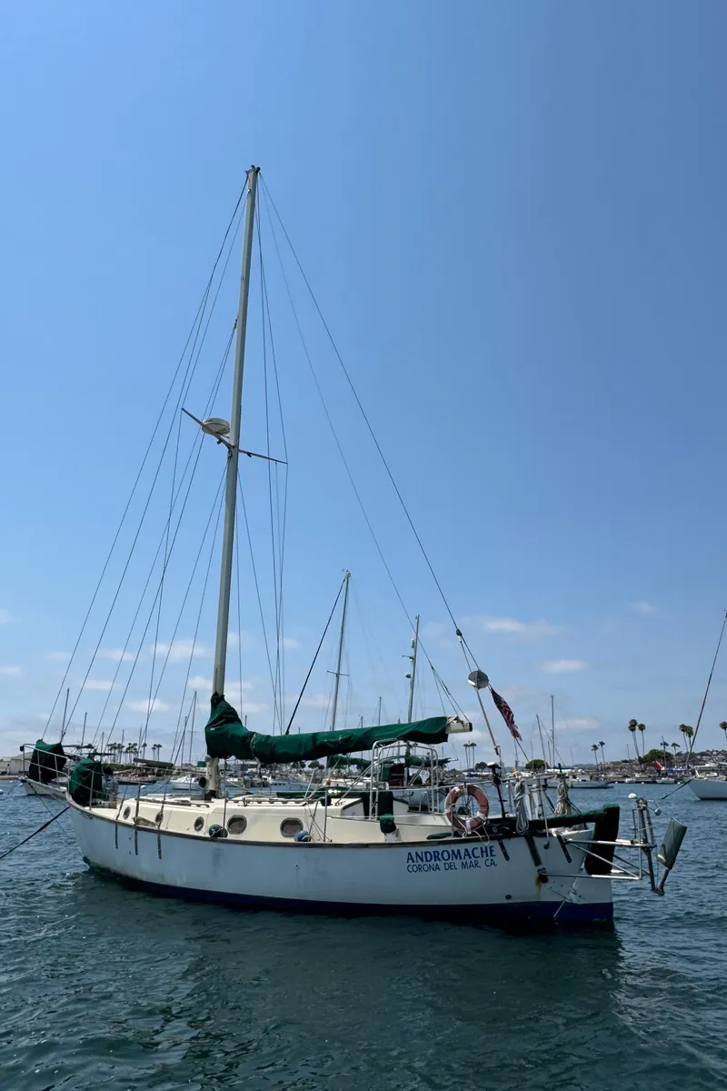 Slide: The Image of Sailboat "Andromache," Bluewater Ingrid 38, 1985, anchored in a sunny marina. - 2