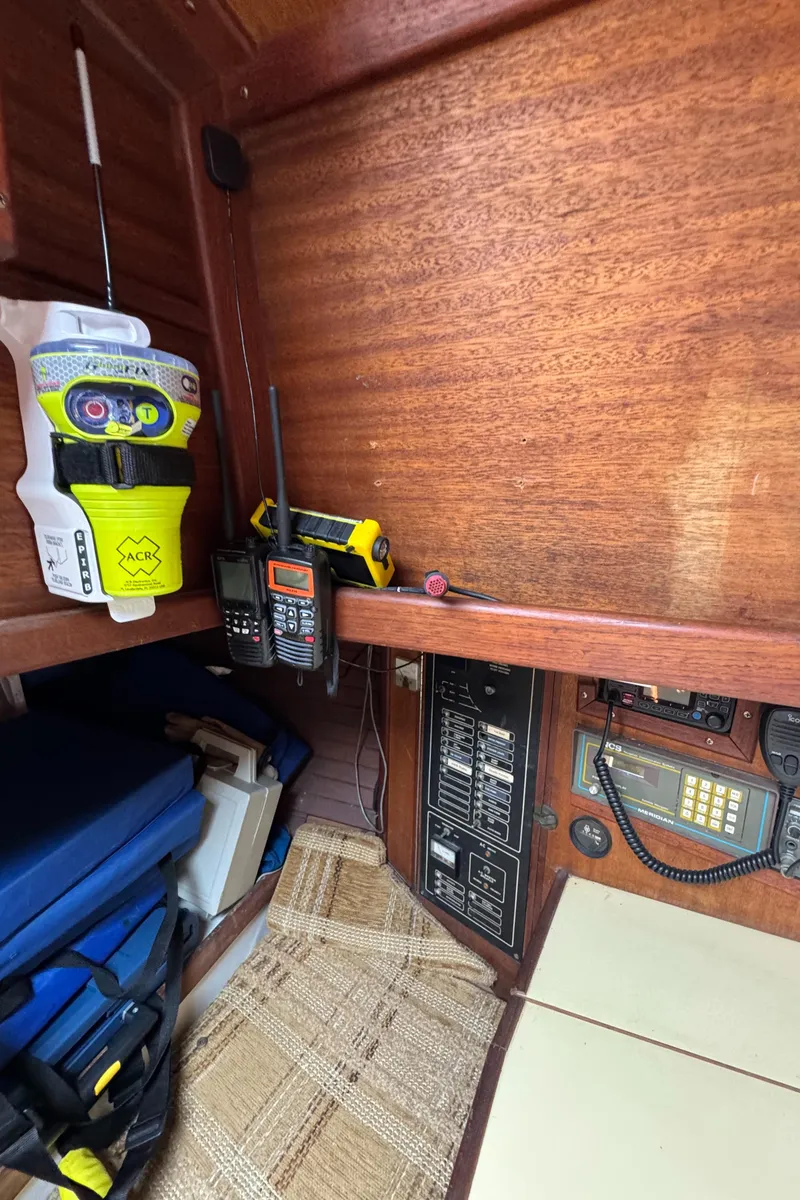 Slide: The Image of Interior of 1985 Bluewater Ingrid 38 sailboat with navigation equipment and emergency gear. - 20