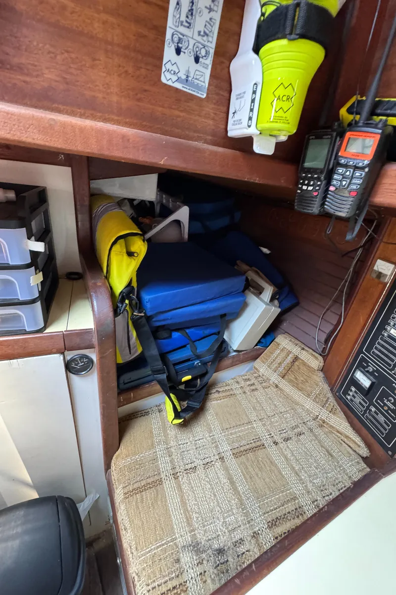 Slide: The Image of Interior of 1985 Bluewater Ingrid 38 with life jackets and communication devices. - 24