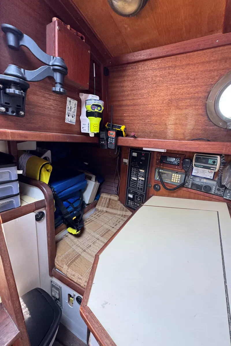 Slide: The Image of Interior of 1985 Bluewater Ingrid 38 sailboat with navigation equipment and storage. - 25