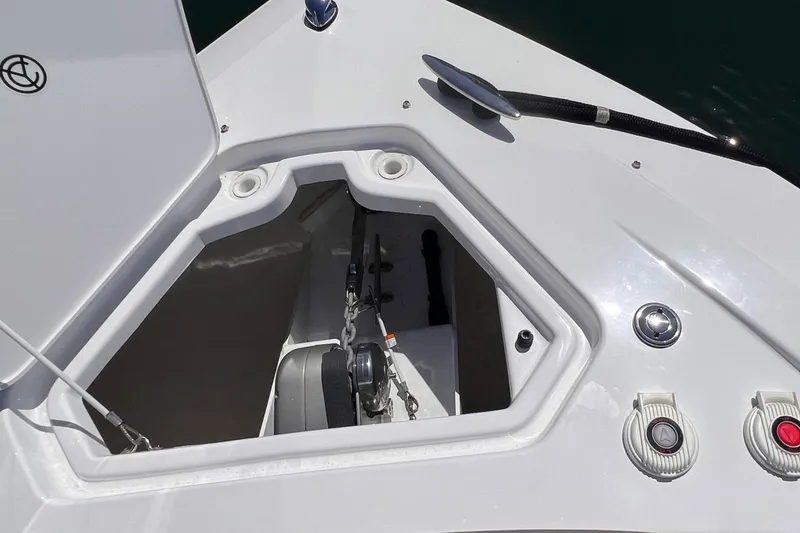 Slide: The Image of 2019 Cruisers Yachts 338 IO anchor compartment with open hatch and controls. - 25