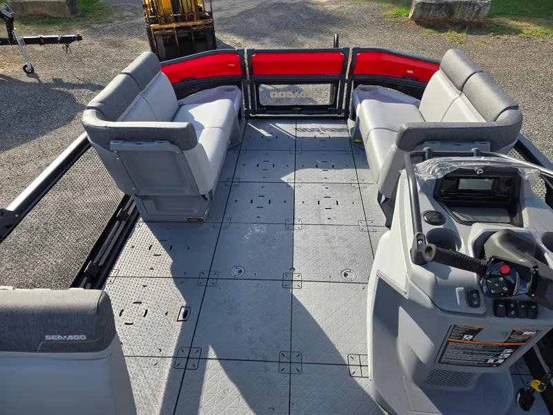 Slide: The Image of 2023 Sea-Doo Switch Cruise 18 interior with gray seating and modern dashboard controls. - 10