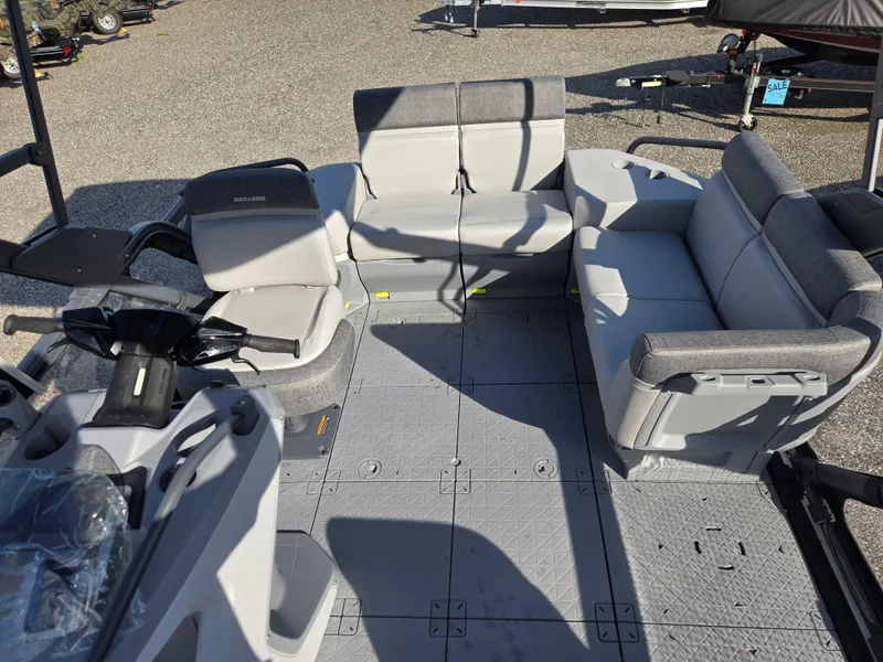 Slide: The Image of 2023 Sea-Doo Switch Cruise 18 interior with gray seating and steering console. - 12
