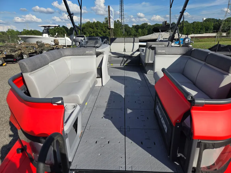 Slide: The Image of 2023 Sea-Doo Switch Cruise 18 pontoon boat interior with spacious seating and modern design. - 13