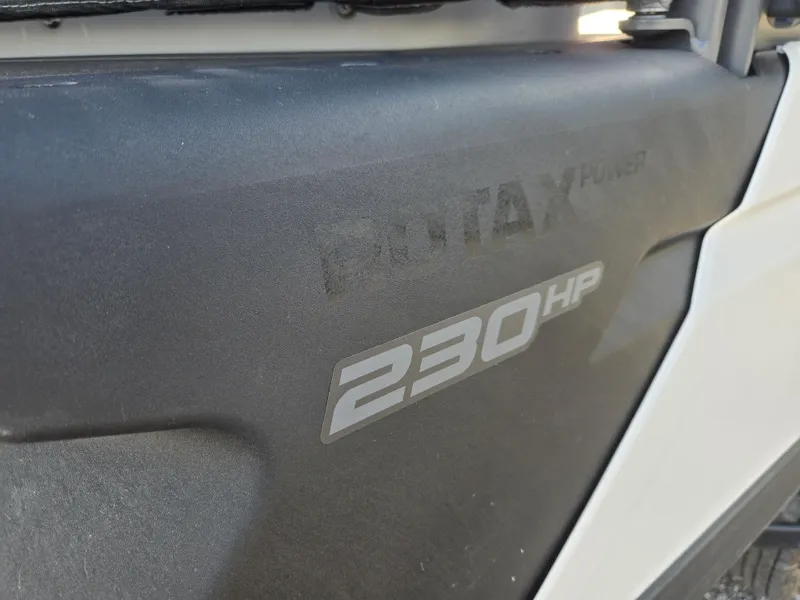 Slide: The Image of Close-up of 2023 Sea-Doo Switch Cruise 18, showcasing 230 HP Rotax engine detail. - 16