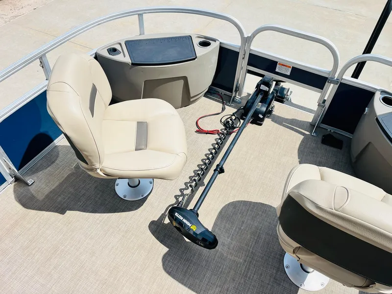 Slide: The Image of 2023 Sun Tracker Bass Buggy 18 DLX interior with seating and trolling motor. - 10