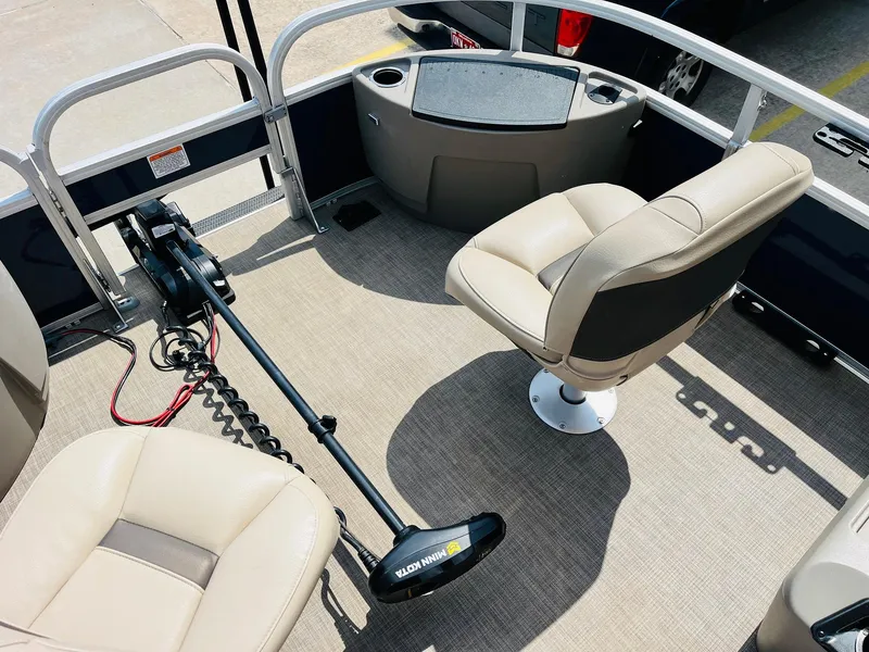 Slide: The Image of 2023 Sun Tracker Bass Buggy 18 DLX interior with seating and trolling motor. - 11