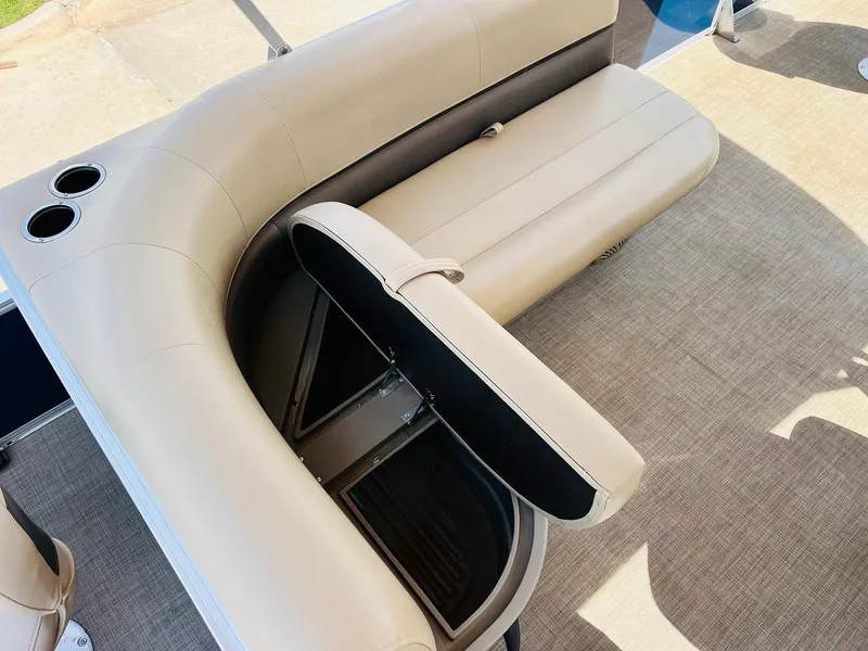 Slide: The Image of 2023 Sun Tracker Bass Buggy 18 DLX boat seat with storage compartment and cup holders. - 18