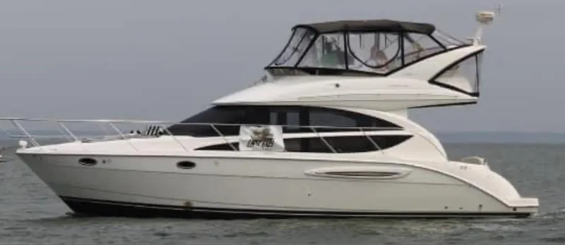 The Image of 2007 Meridian 391 Sedan yacht cruising on calm waters. - 0