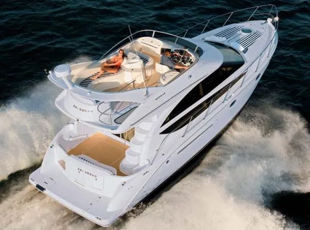 Slide: The Image of 2007 Meridian 391 Sedan yacht cruising on open water, featuring spacious deck and modern design. - 100