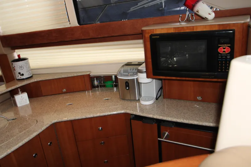 Slide: The Image of 2007 Meridian 391 Sedan kitchen with microwave, coffee maker, and granite countertops. - 12