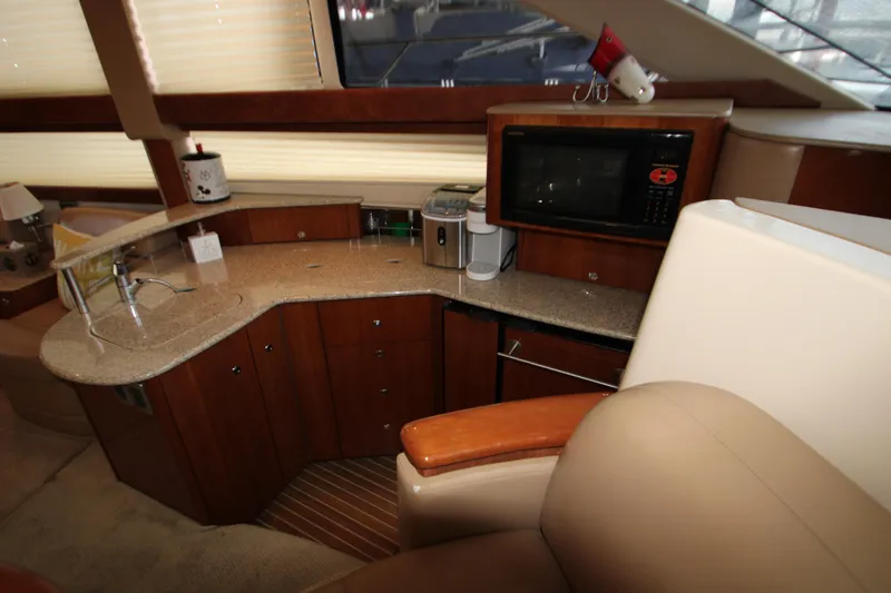 Slide: The Image of Interior of 2007 Meridian 391 Sedan yacht with kitchenette and modern amenities. - 15