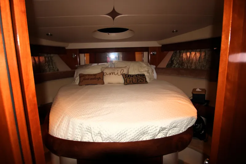 Slide: The Image of Luxurious bedroom interior of 2007 Meridian 391 Sedan yacht with cozy bedding. - 19