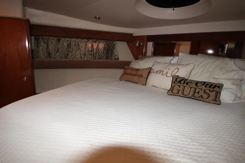 Slide: The Image of Luxurious bedroom interior of 2007 Meridian 391 Sedan yacht with decorative pillows. - 20