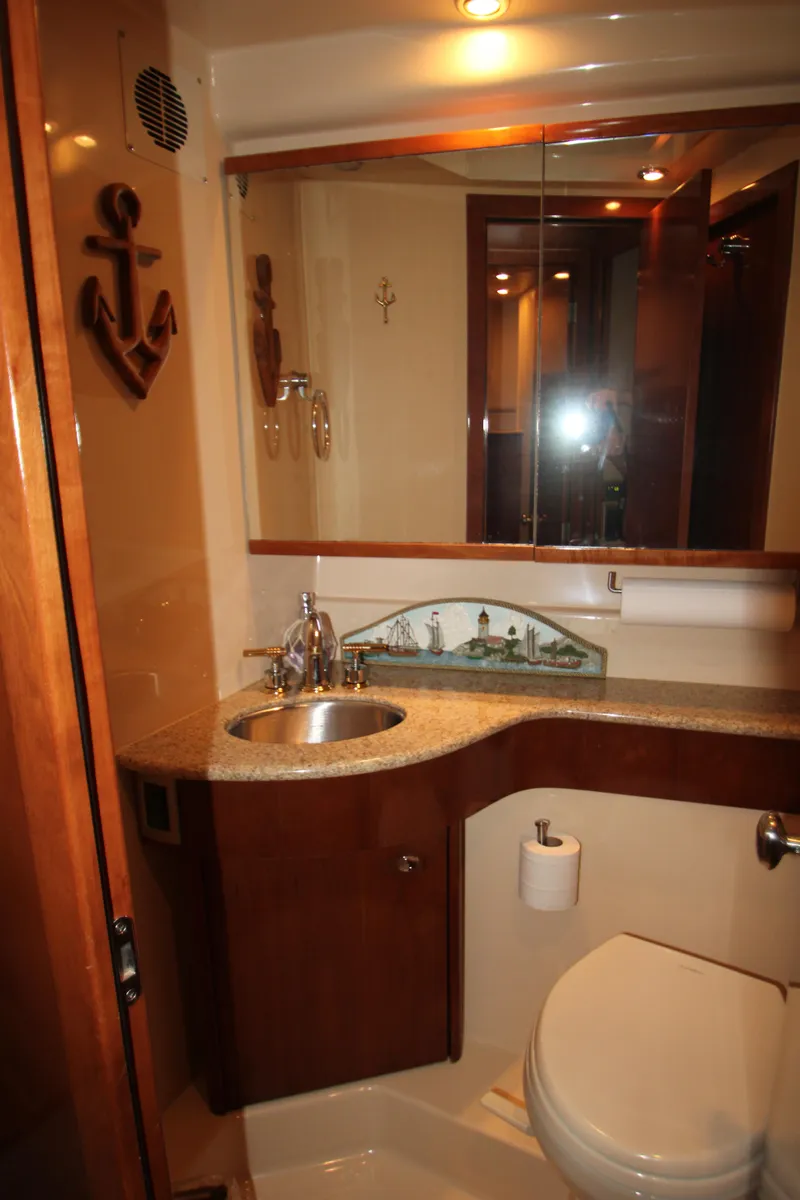 Slide: The Image of Luxurious bathroom in 2007 Meridian 391 Sedan yacht with modern fixtures and nautical decor. - 24