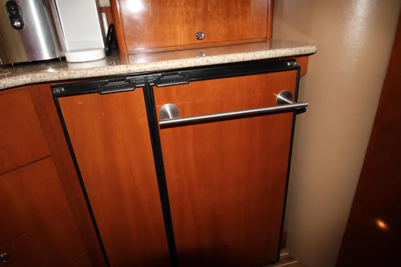 Slide: The Image of Wooden cabinetry with stainless steel handle in 2007 Meridian 391 Sedan yacht interior. - 33
