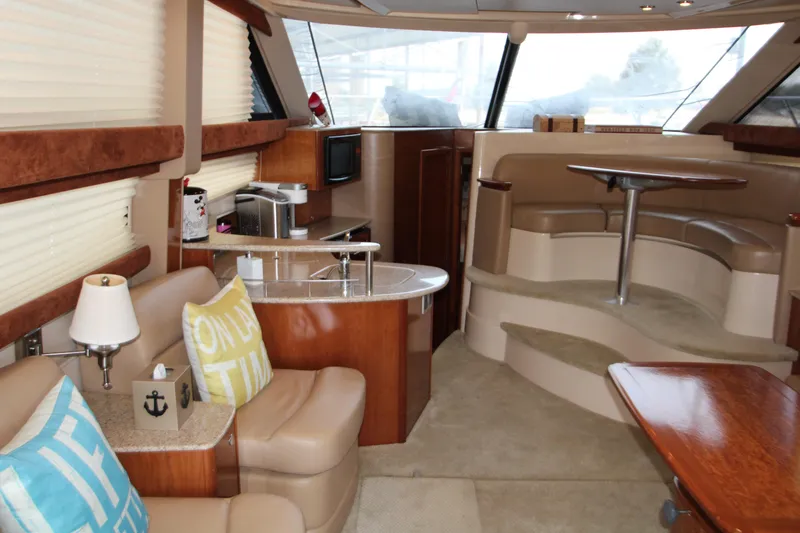 Slide: The Image of Luxurious interior of a 2007 Meridian 391 Sedan yacht with seating and dining area. - 4