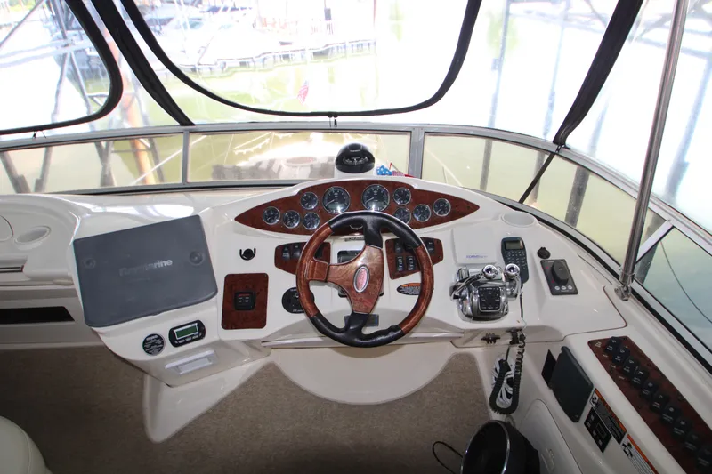 Slide: The Image of 2007 Meridian 391 Sedan helm with wood-accented steering wheel and navigation controls. - 40