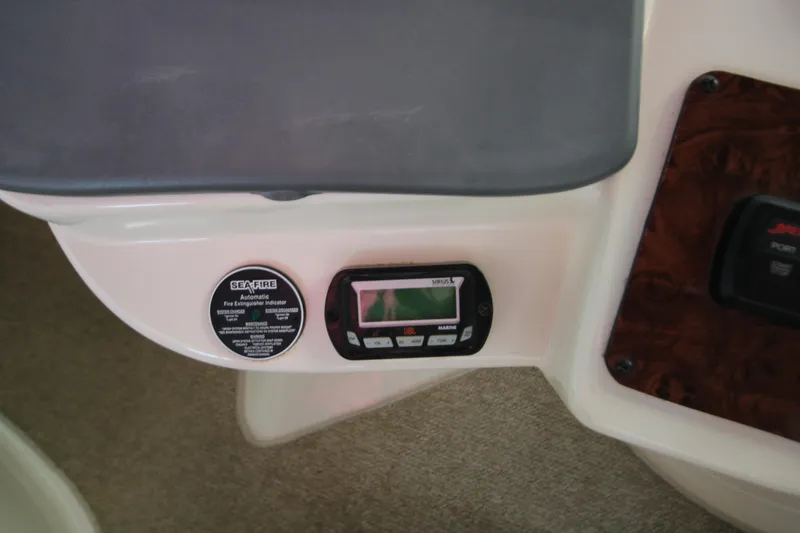 Slide: The Image of Control panel of a 2007 Meridian 391 Sedan with fire extinguisher indicator and marine radio. - 42