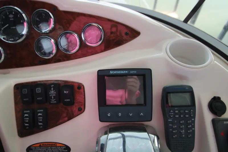 Slide: The Image of Dashboard of a 2007 Meridian 391 Sedan with gauges and navigation equipment. - 45