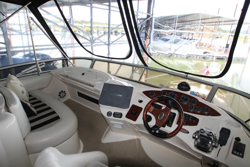 Slide: The Image of 2007 Meridian 391 Sedan helm with modern controls and panoramic marina view. - 50