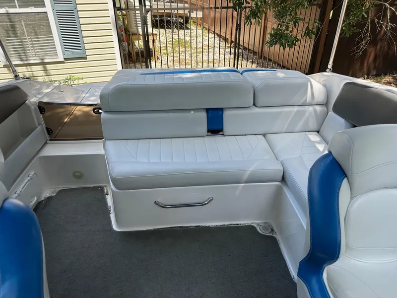 Slide: The Image of 2008 Regal 2250 Cuddy boat interior with white and blue seating. - 19