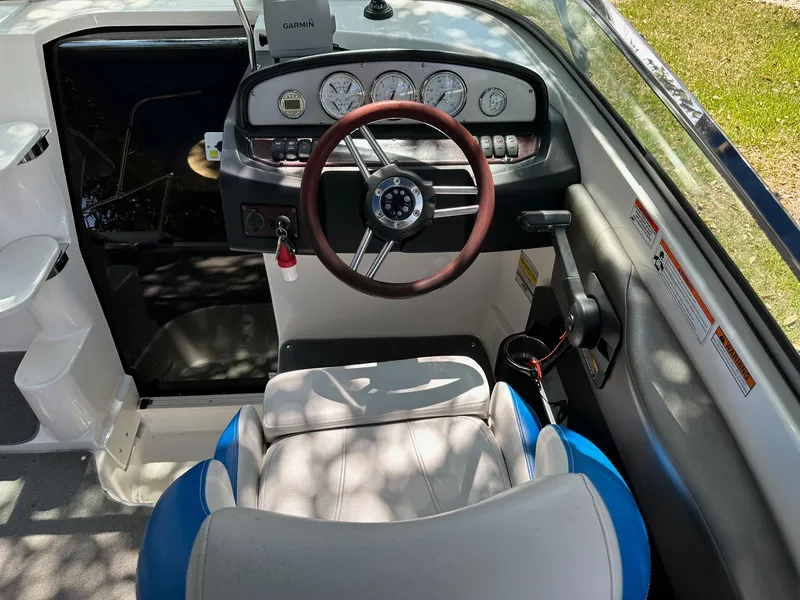 Slide: The Image of 2008 Regal 2250 Cuddy boat cockpit with steering wheel and instrument panel. - 26