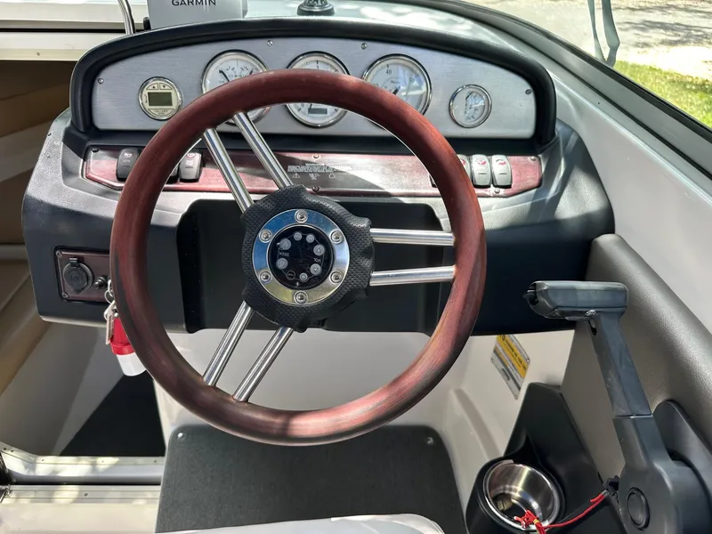 Slide: The Image of Steering wheel and dashboard of 2008 Regal 2250 Cuddy boat. - 27
