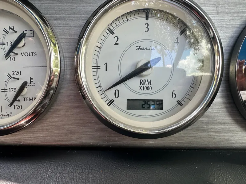 Slide: The Image of Close-up of 2008 Regal 2250 Cuddy boat gauges showing RPM and voltage. - 28