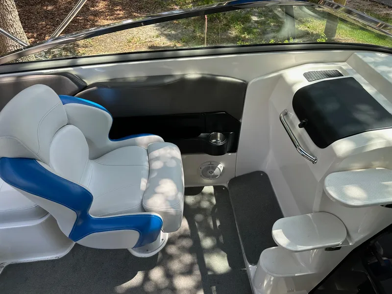 Slide: The Image of 2008 Regal 2250 Cuddy boat interior with blue and white seating and steps. - 30