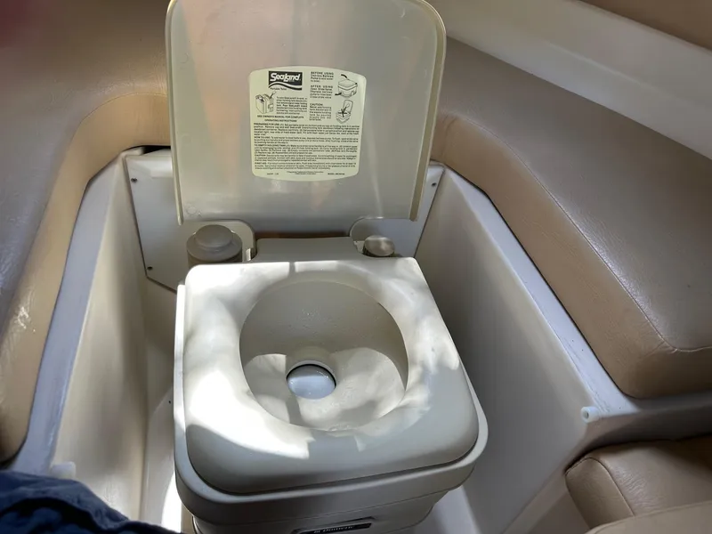 Slide: The Image of Portable toilet in 2008 Regal 2250 Cuddy boat interior. - 34