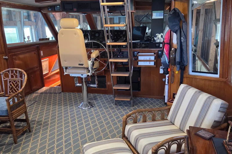 Slide: The Image of Interior of 1985 Chris-Craft 500 Constellation Motor Yacht with helm and seating area. - 14