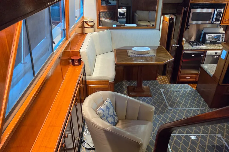 Slide: The Image of Luxurious interior of 1985 Chris-Craft 500 Constellation Motor Yacht with dining area and kitchen. - 22
