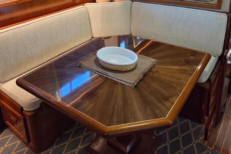 Slide: The Image of Luxurious dining area in 1985 Chris-Craft 500 Constellation Motor Yacht with elegant wood table. - 24