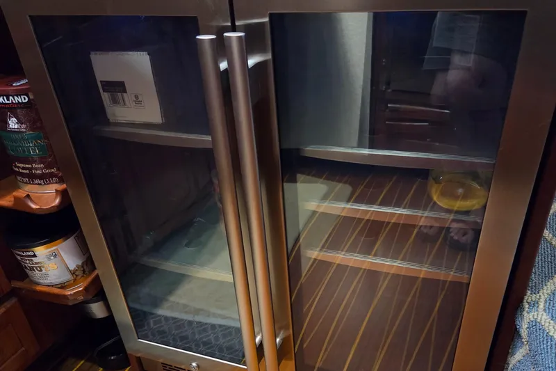 Slide: The Image of Glass-door refrigerator inside 1985 Chris-Craft 500 Constellation Motor Yacht kitchen area. - 27