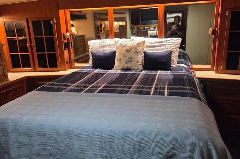 Slide: The Image of Luxurious bedroom interior of 1985 Chris-Craft 500 Constellation Motor Yacht with elegant bedding. - 37