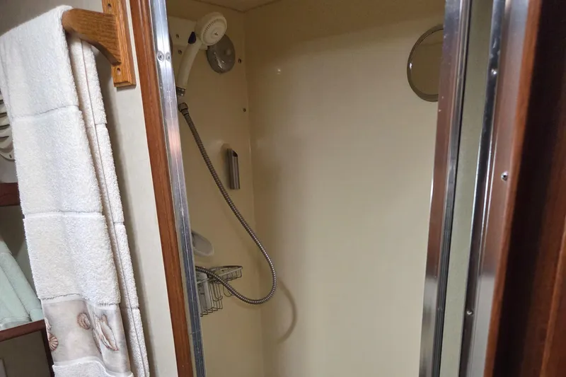 Slide: The Image of Shower area in 1985 Chris-Craft 500 Constellation Motor Yacht with towel and showerhead. - 44