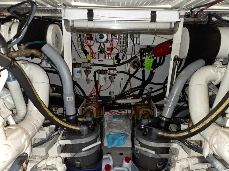 Slide: The Image of Engine room of 1985 Chris-Craft 500 Constellation Motor Yacht with complex machinery and wiring. - 46
