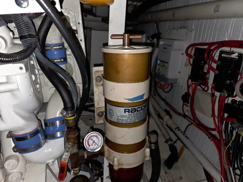 Slide: The Image of Engine room of 1985 Chris-Craft 500 Constellation Motor Yacht with Racor fuel filter system. - 47