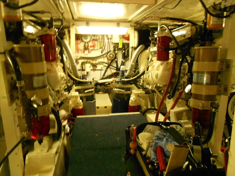 Slide: The Image of Engine room of 1985 Chris-Craft 500 Constellation Motor Yacht, showcasing mechanical components and systems. - 48