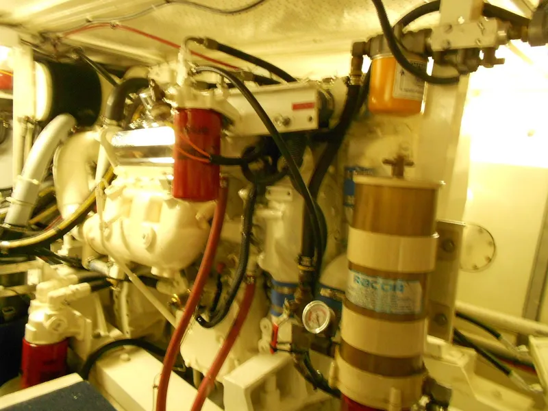 Slide: The Image of Engine room of 1985 Chris-Craft 500 Constellation Motor Yacht with visible machinery and components. - 49