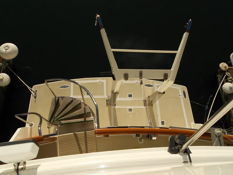 Slide: The Image of 1985 Chris-Craft 500 Constellation Motor Yacht deck view with spiral staircase. - 7